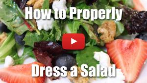 Learn how to properly dress a salad using oil and vinegar.